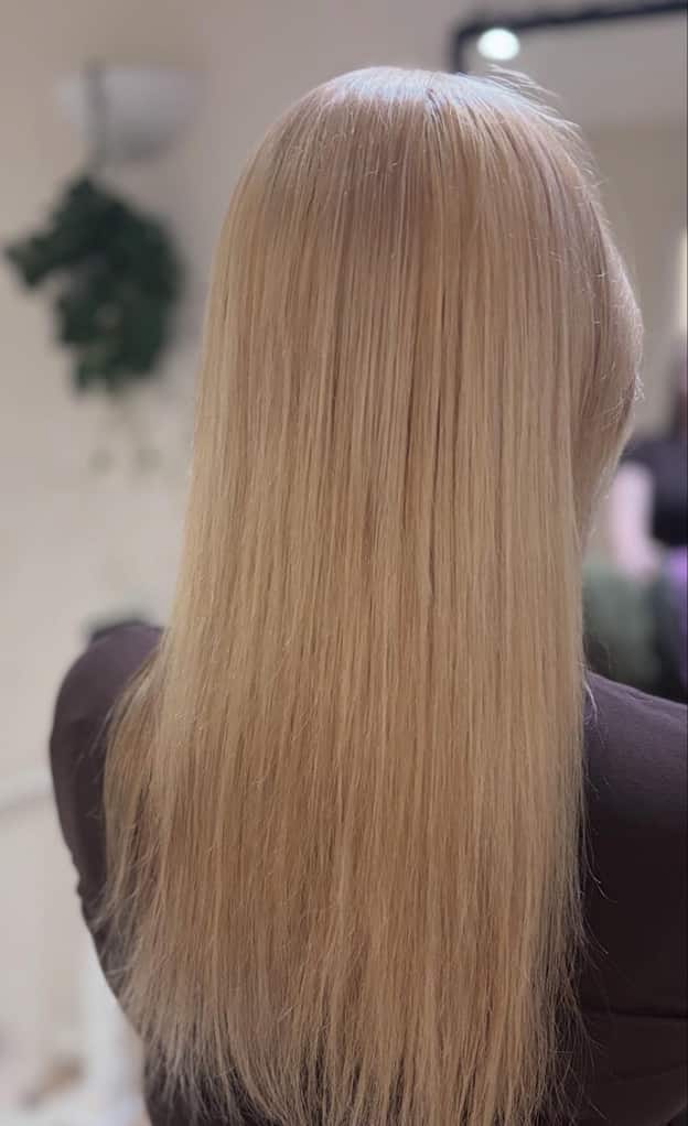 Long platinum blonde hair in a clean cool icy tone