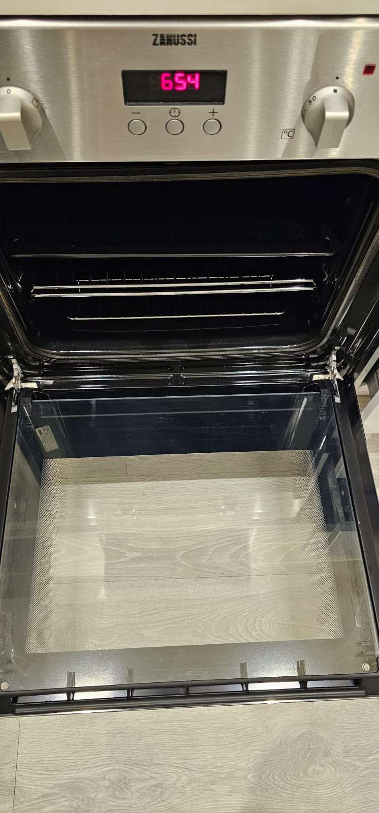 Sparkling clean interior of a Zanussi oven after professional oven cleaning