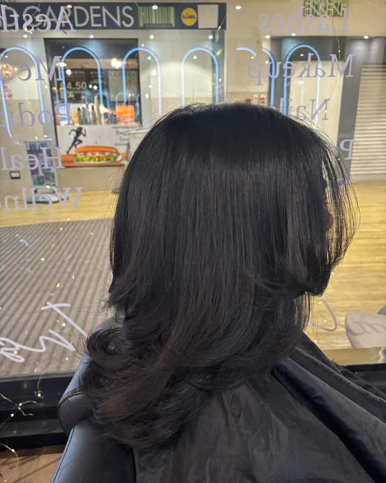 Dark brown hair with elegant side-flicked ends