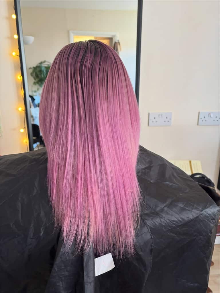 Soft pastel-pink ombre from mauve roots to baby-pink ends
