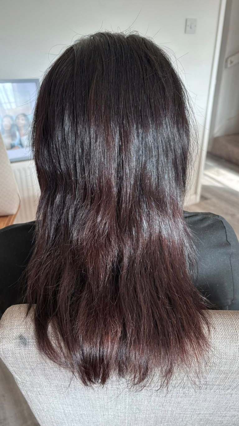 Long mahogany-brown hair extensions with natural movement
