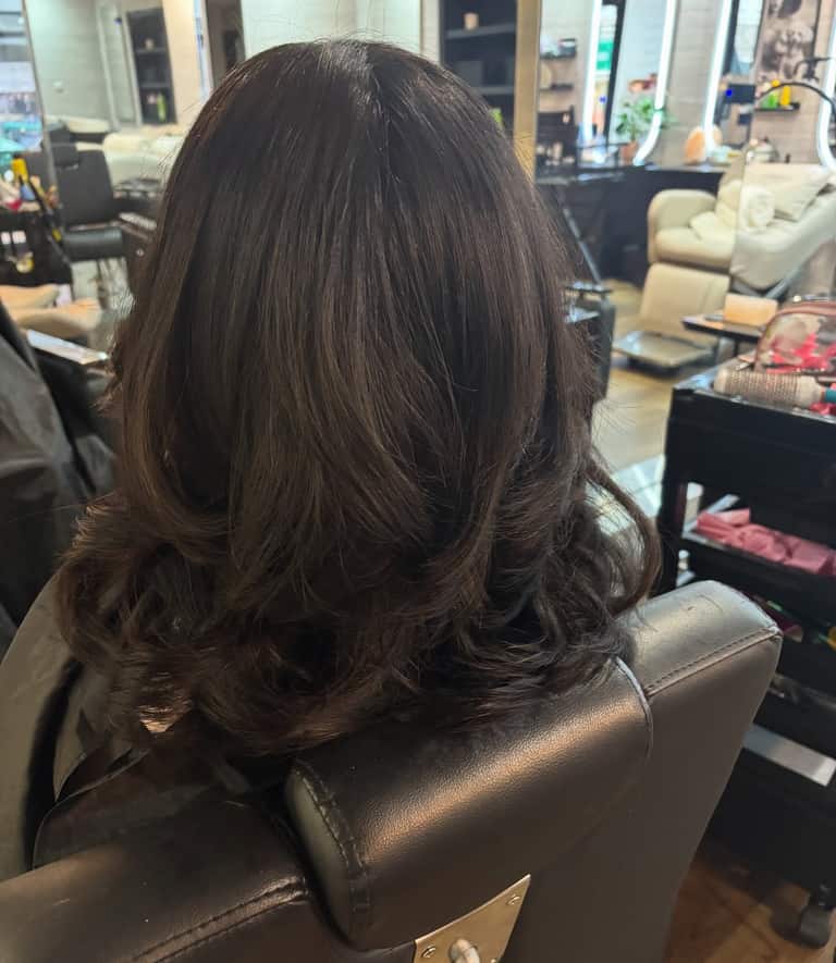 Layered brown hair with soft outward flicks