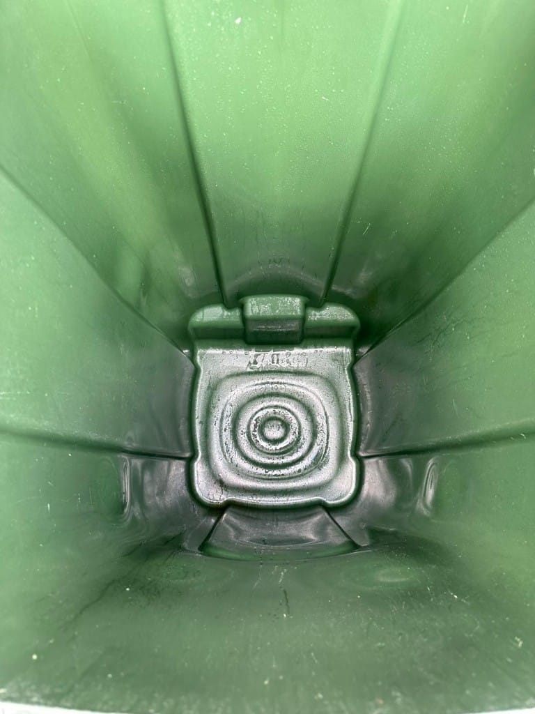 Spotless interior of the same green wheelie bin after a professional eco-friendly clean