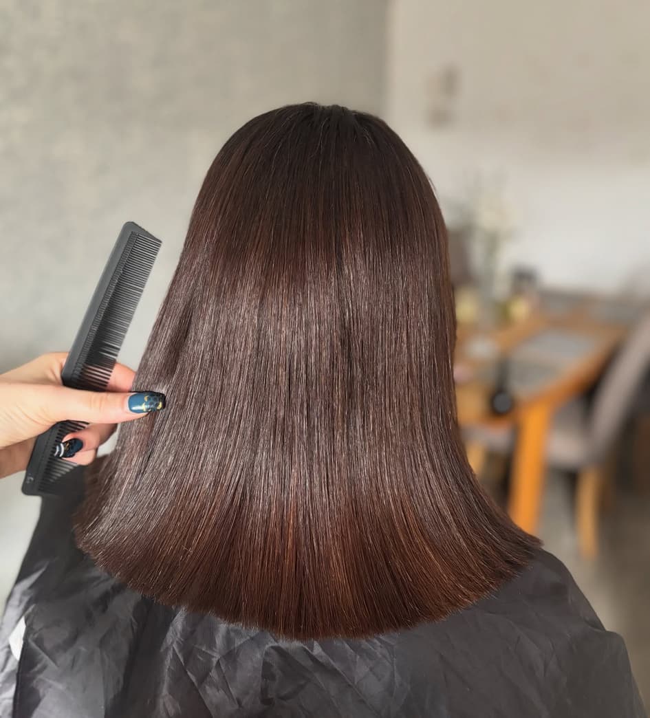 Glossy precision blunt-cut bob in chocolate brown