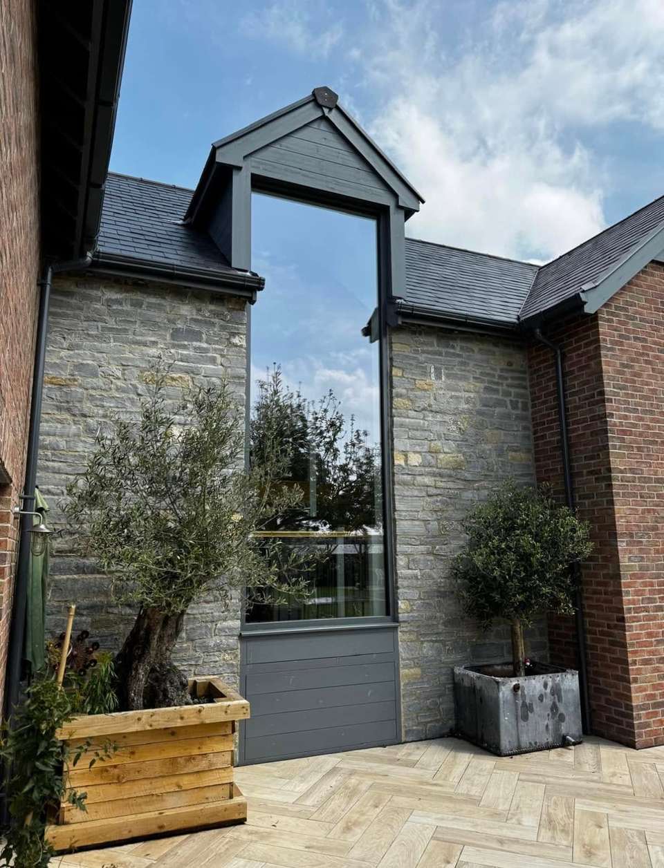 Full-height feature window on a stone barn cleaned to a streak-free finish