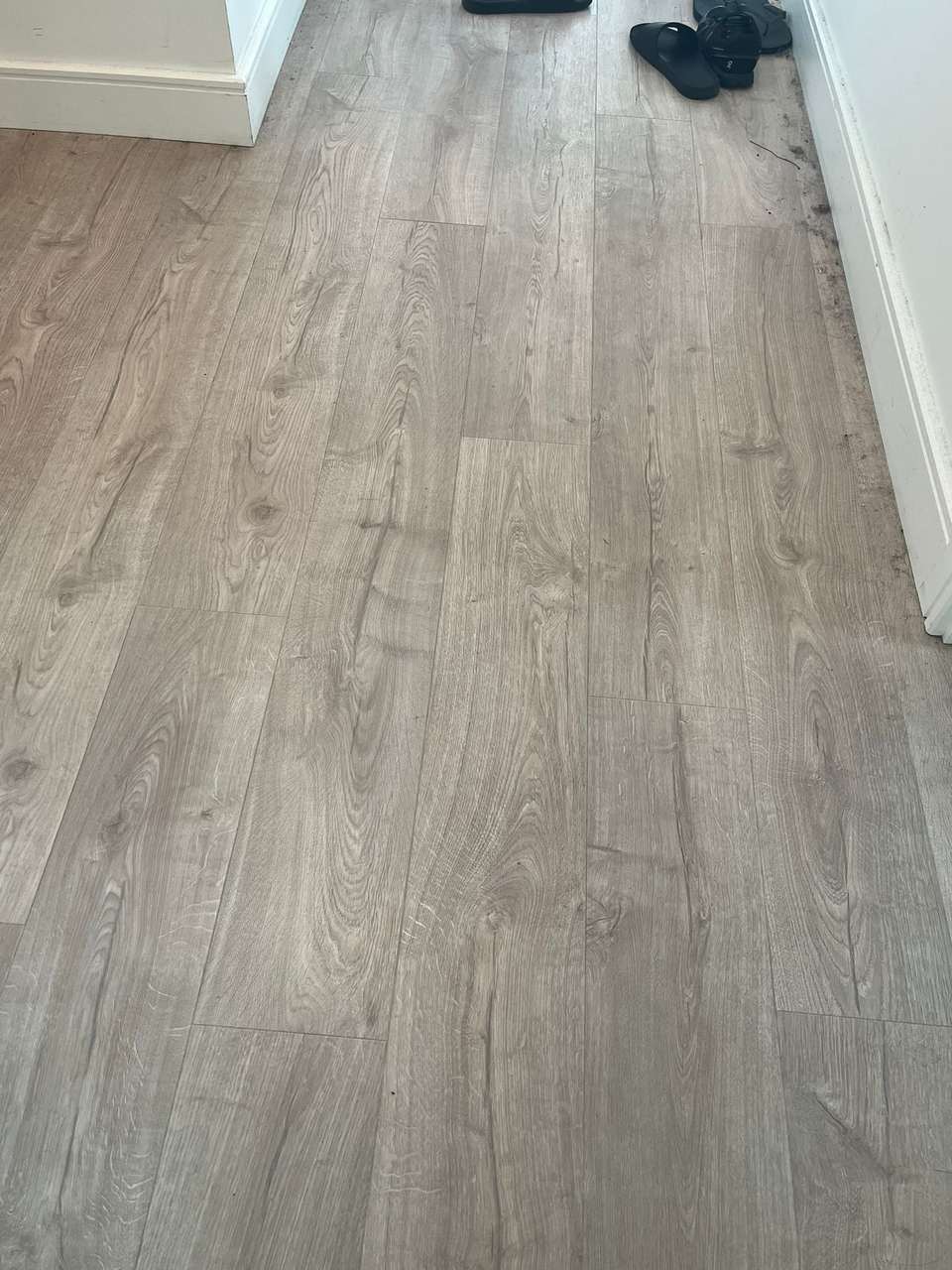 Clean grey laminate floor after cleaning, free of dust and debris