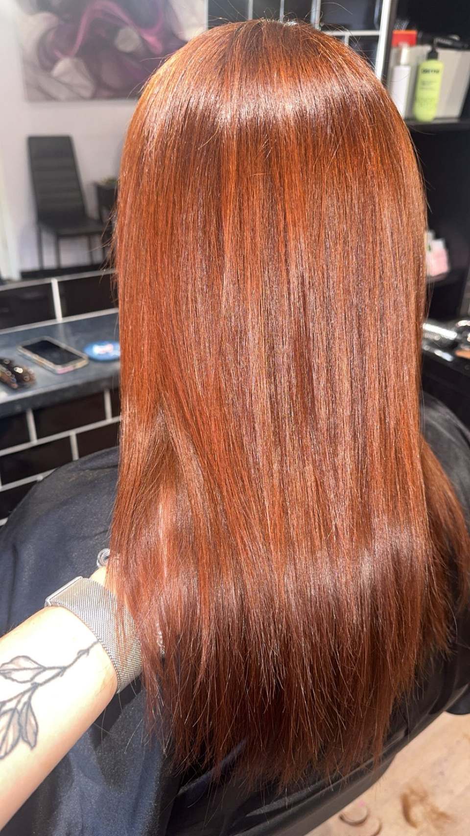 Long copper-red coloured hair with high shine