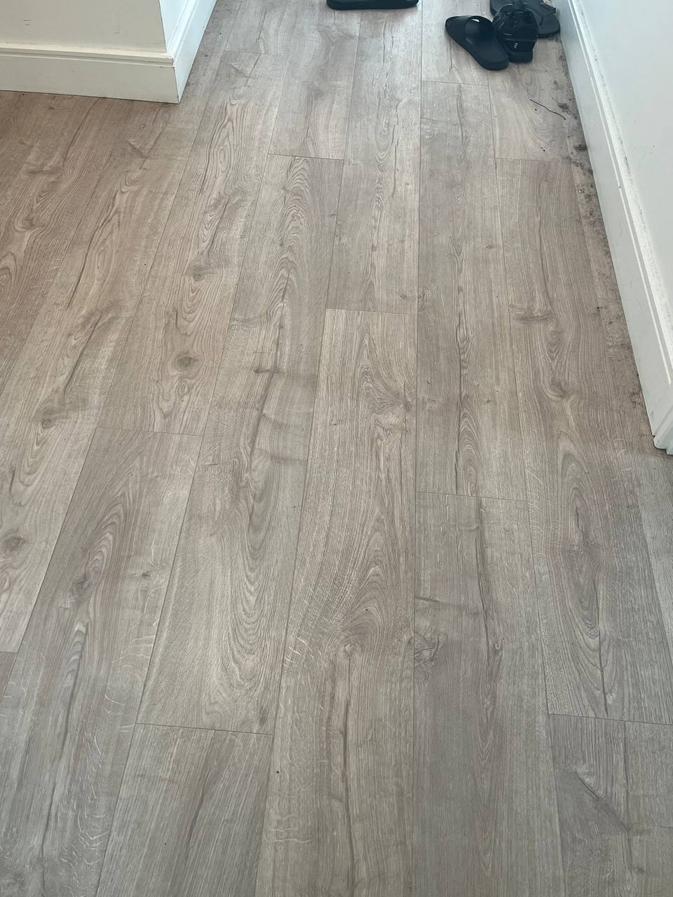 Clean grey laminate floor after cleaning, free of dust and debris