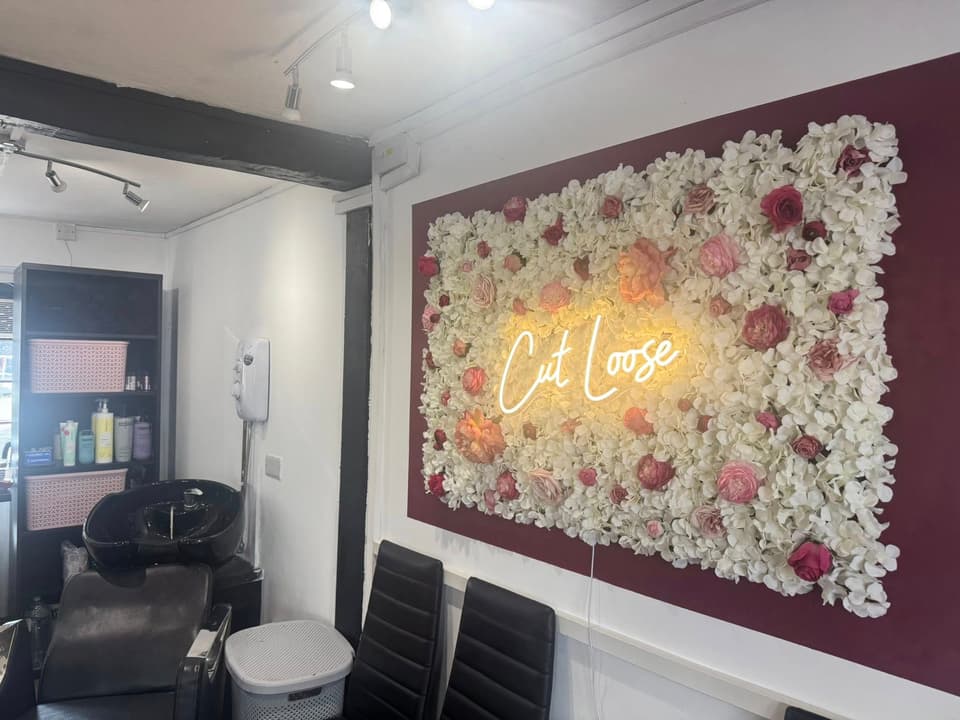 Inside Cut Loose Unisex Hair Studio — floral feature wall and wash basin in the boutique Blandford salon
