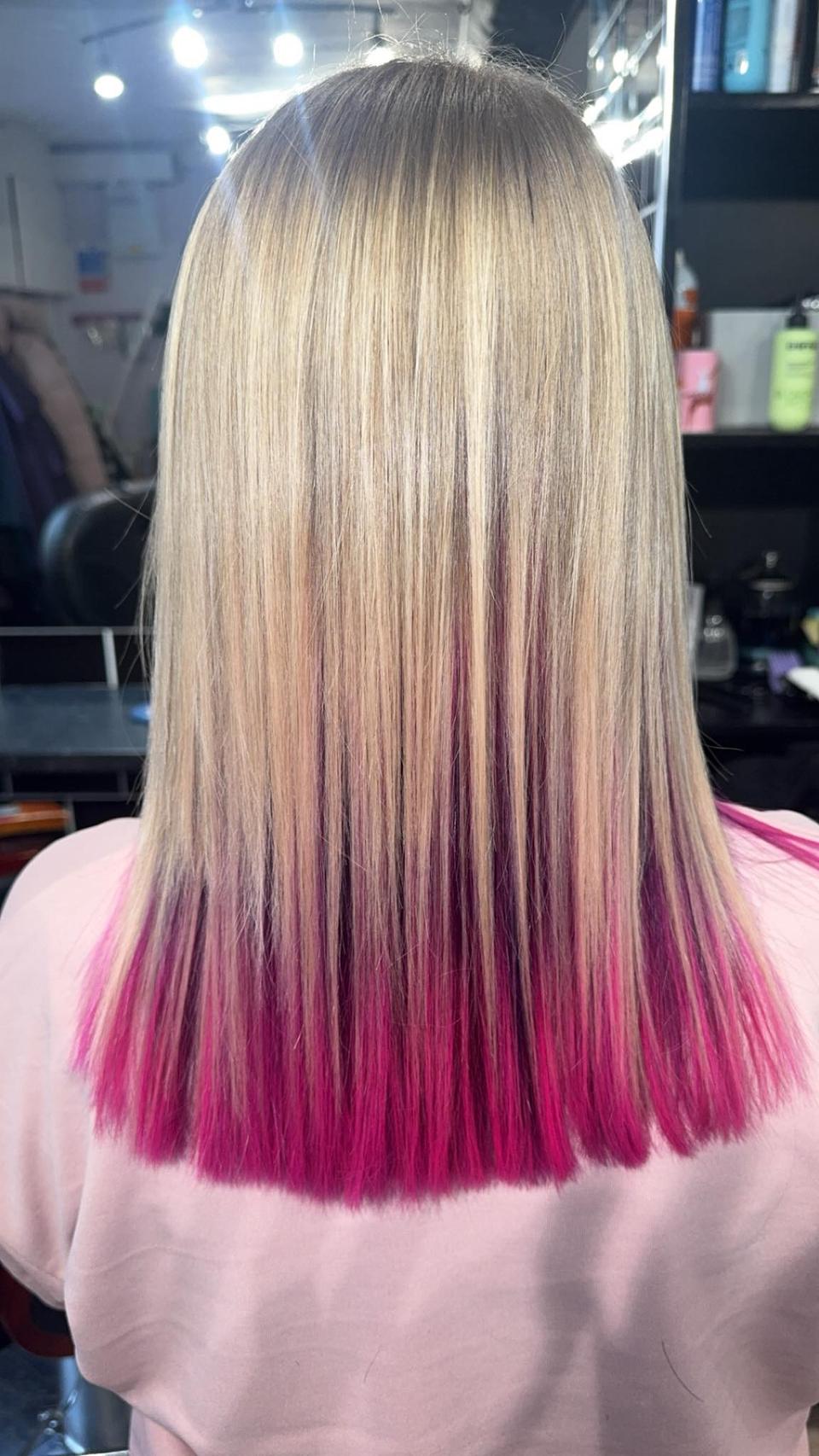 Blonde hair with vivid magenta and pink dip-dyed ends, expertly blended