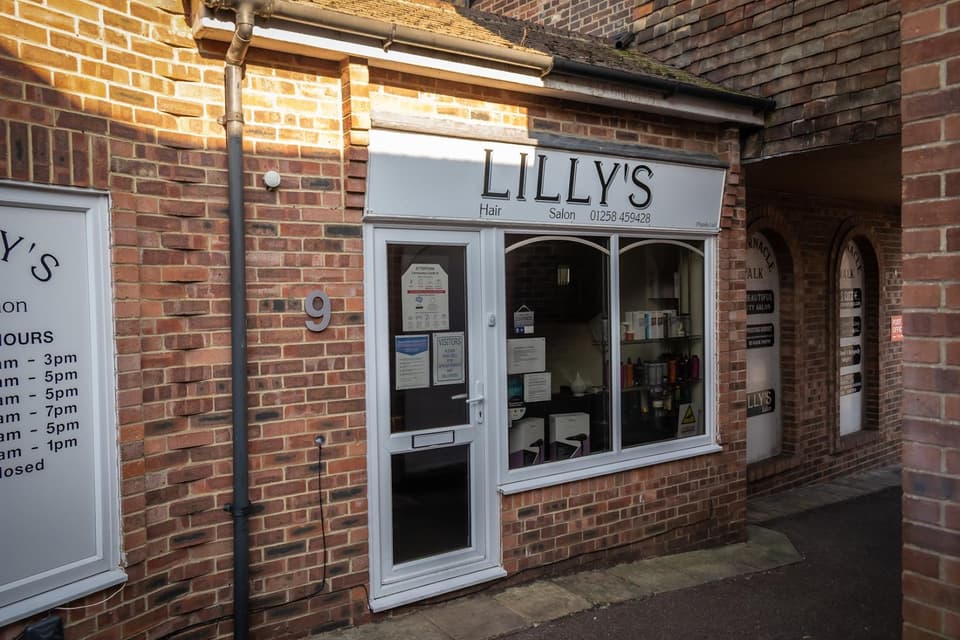 Lilly's Hair Salon shopfront on Tabernacle Walk in Blandford Forum, Dorset