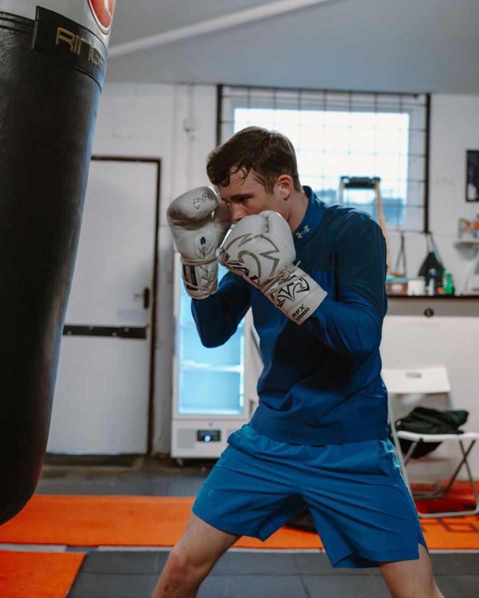 Frankie Wood training on the heavy bag at the gym