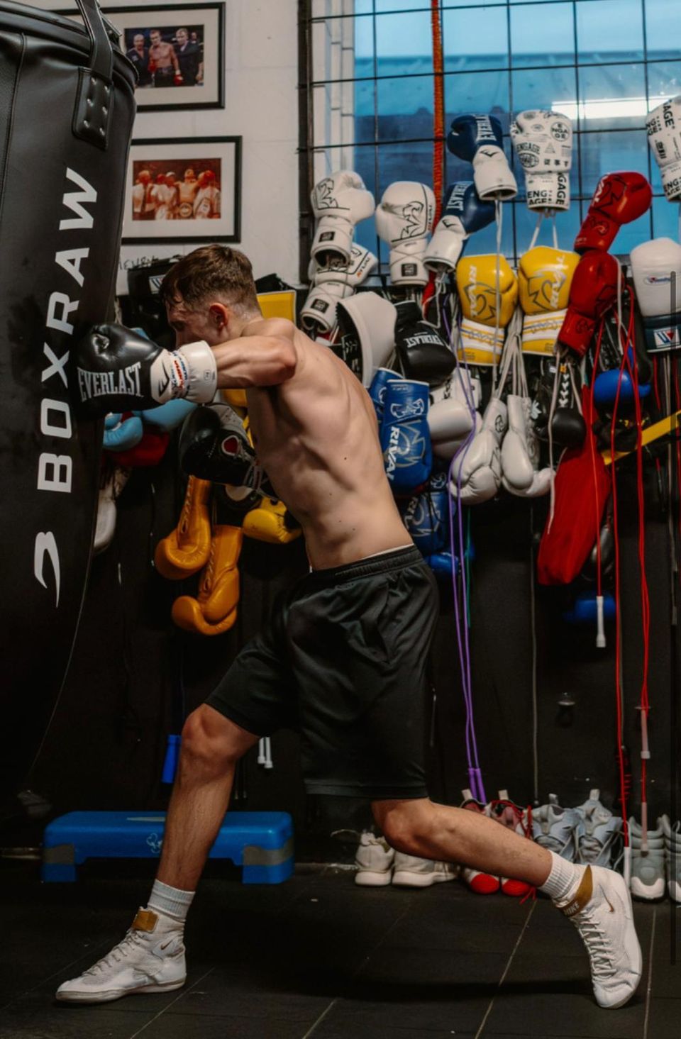 Frankie Wood shirtless training on the heavy bag