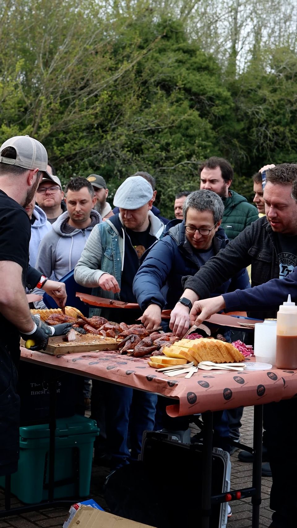Class attendees serving themselves outdoors