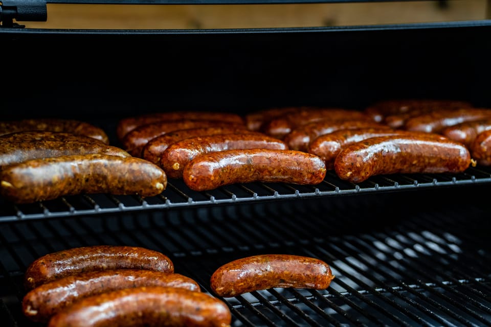 Sausages on the Wilson's BBQ smoker grate