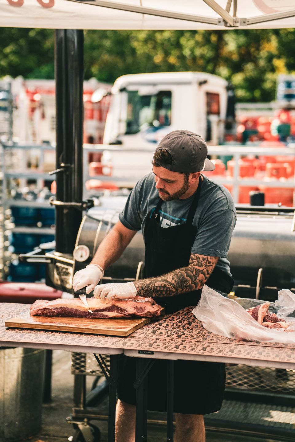 David trimming a brisket on a cutting board