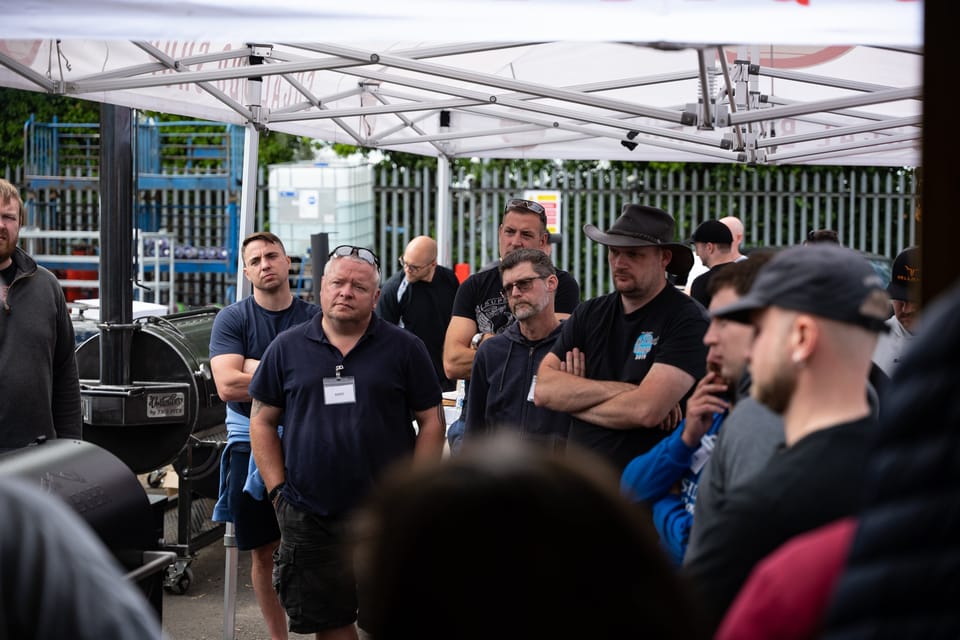 Attentive class attendees listening at a Wilson's BBQ class