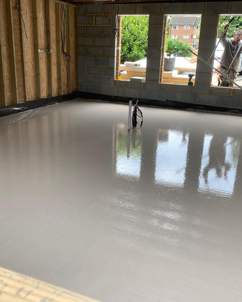 Freshly poured self-levelling screed floor in a new house extension